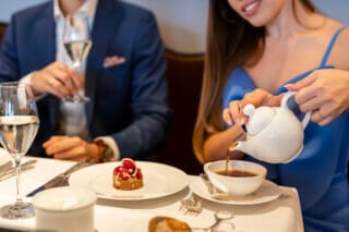 Colourful macarons and fresh berries served on an elegant étagère.